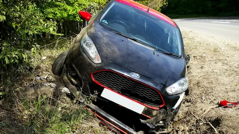 Crashed car in a ditch